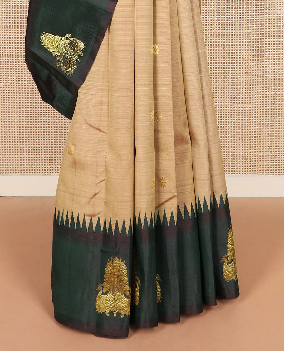 Brown zari buttas Kanchipuram silk saree, contrast thazampoo rekku border of mayil designs, and pallu of rekku, rudraksham, and kodi visiry designs