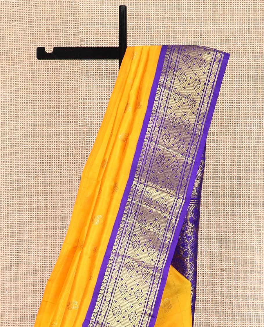 Yellow Kanchipuram Silk Saree Subtly Sparkled with Zari Buttas All Over Its Body, Complemented by a Contrast One-Sided Korvai Border of Manga Mokku, and Jaal Designs, Majestically Woven Pallu of Floral Jaal Designs, and Comes Without a Blouse