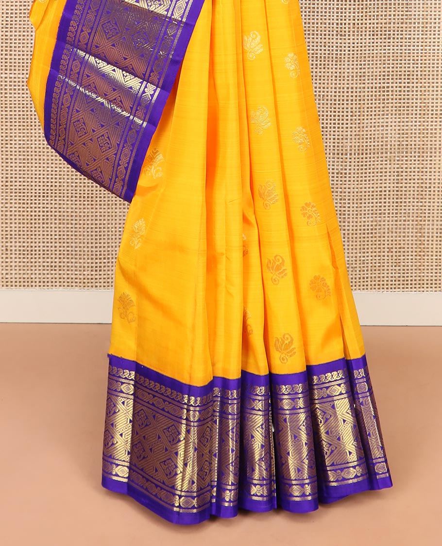 Yellow Kanchipuram Silk Saree Subtly Sparkled with Zari Buttas All Over Its Body, Complemented by a Contrast One-Sided Korvai Border of Manga Mokku, and Jaal Designs, Majestically Woven Pallu of Floral Jaal Designs, and Comes Without a Blouse