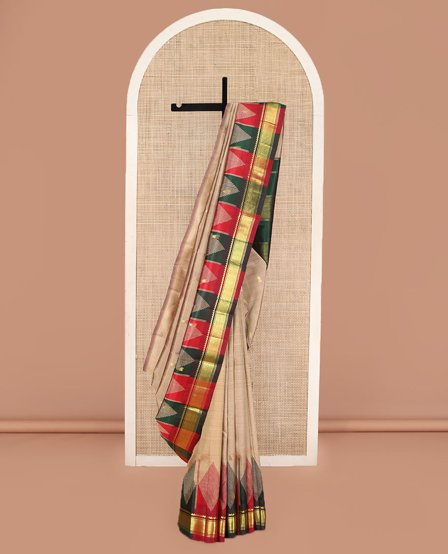 Sandal Kanchipuram Silk Saree, Elevated with Zari Buttas on Its Body, Complemented by a Contrast One-Sided Temple Border of Thilakam Mokku, and Jaal Designs, Pallu Depicts Zari Designs, and Comes Without a Blouse