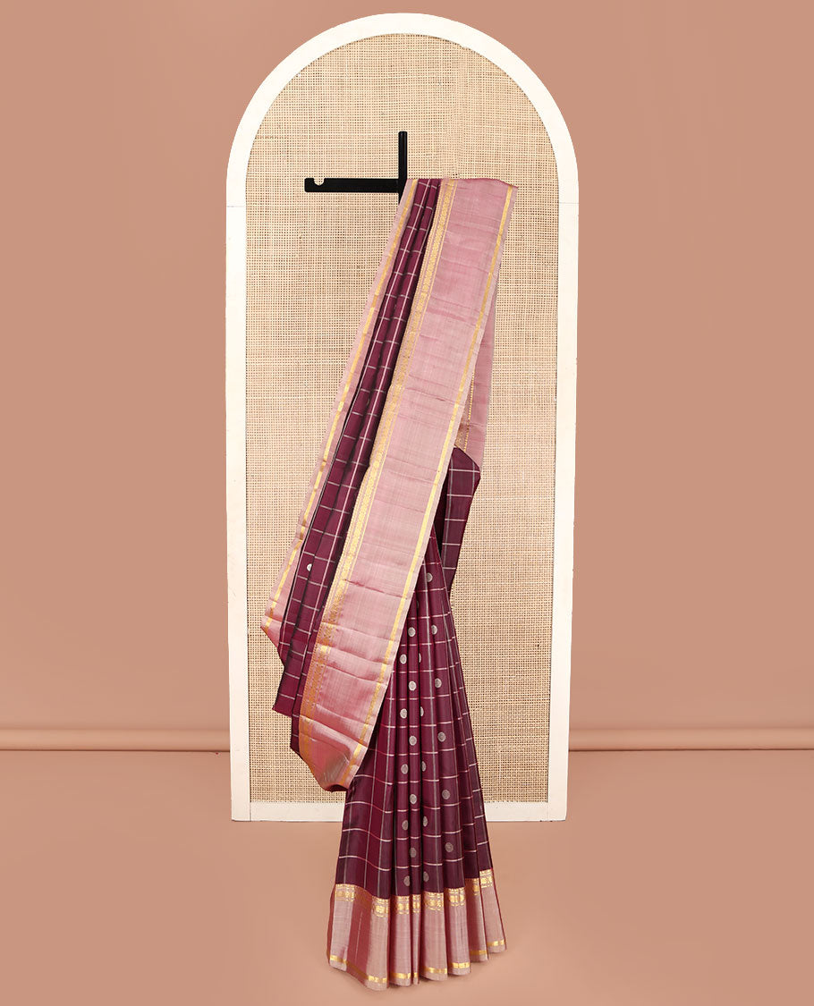 Maroon Kanchipuram Silk Saree, Richly Detailed with Chakram Buttas Enclosed Checks, Complemented by a Contrast Rettai Pettu Border of Rekku, Banaras, Muthu, and Poun Designs, Pallu Steeped with Chakram Motifs, and Paired with a Contrast Blouse