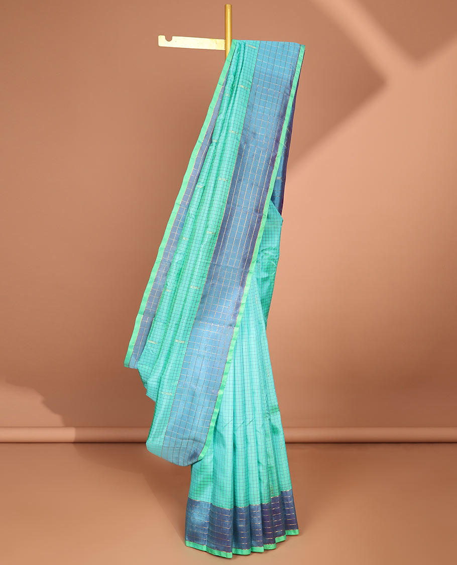 Blue checked kancheepuram silk saree with contrast floral zari design & intricate zari design pallu