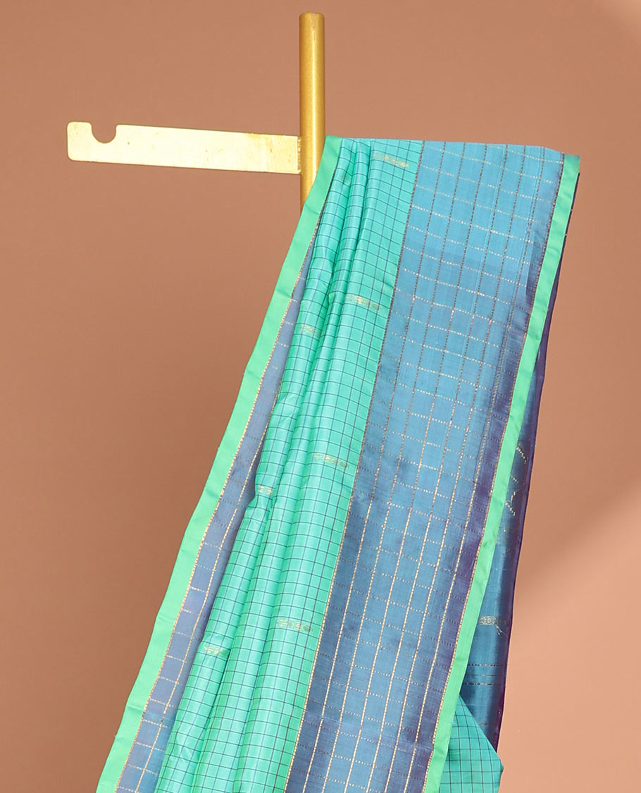 Blue checked kancheepuram silk saree with contrast floral zari design & intricate zari design pallu