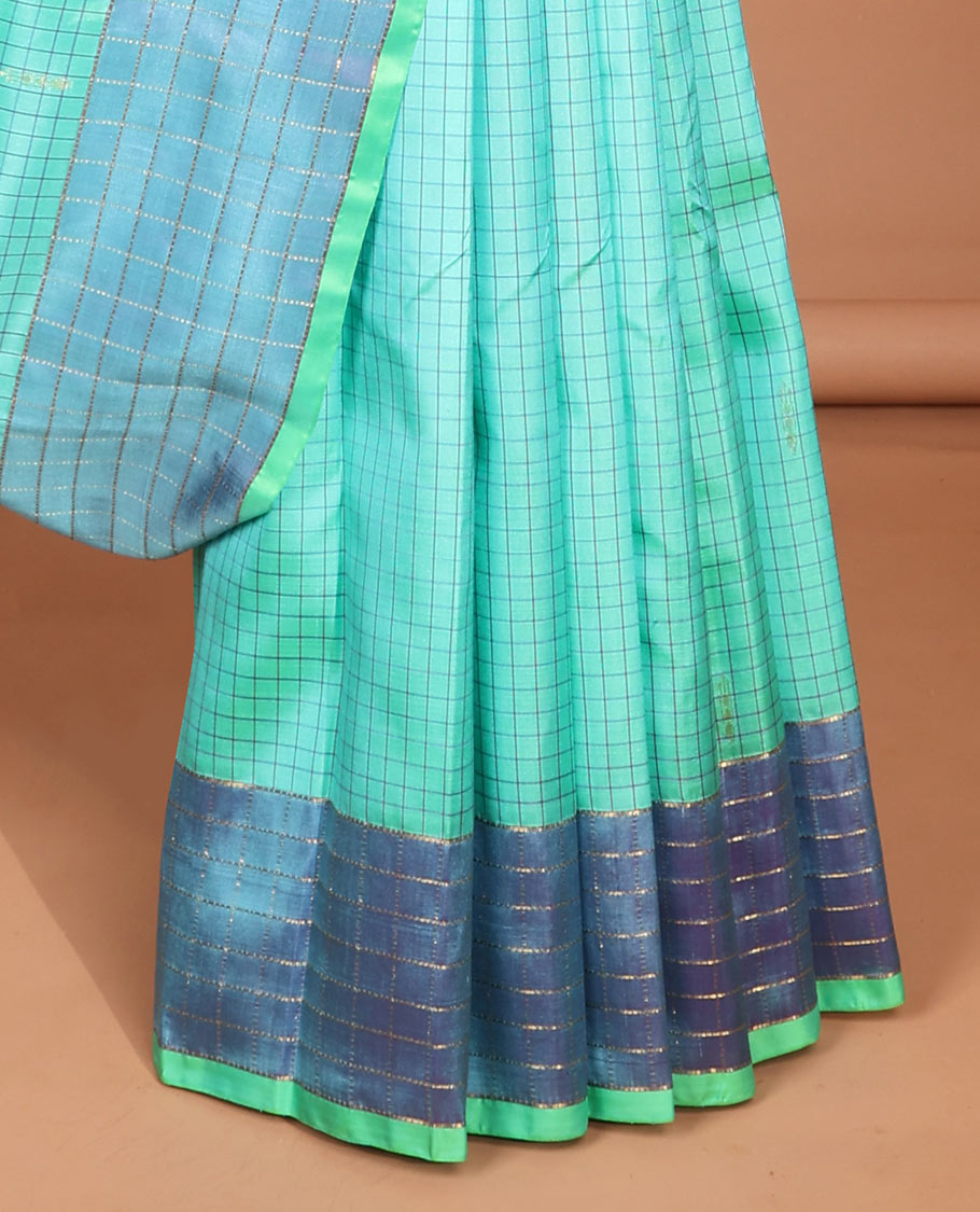 Blue checked kancheepuram silk saree with contrast floral zari design & intricate zari design pallu