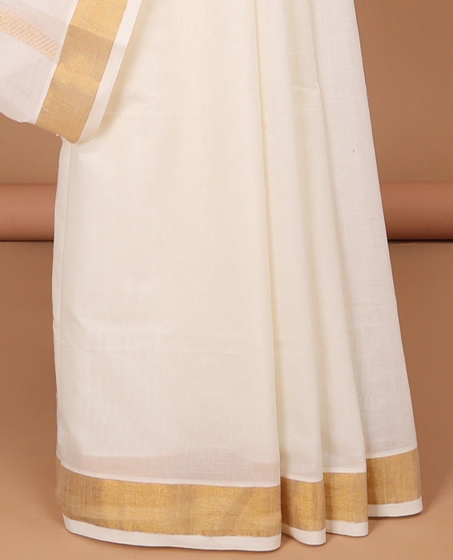 Cream kerala saree with zari stripes, zari border & pallu of floral & paisley zari designs