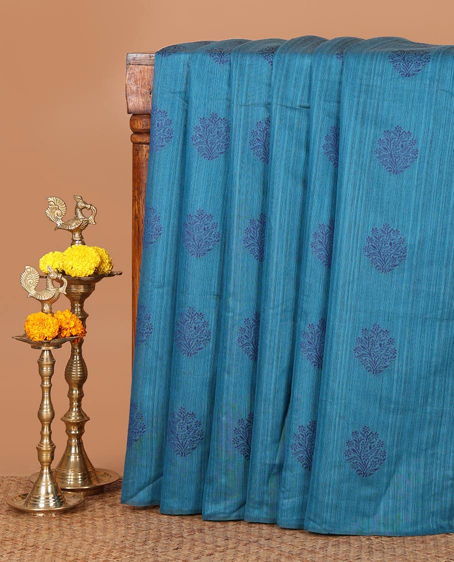 Borderless blue banaras jute silk saree with floral thread buttas woven all over it's body, intricate pallu & butta design blouse