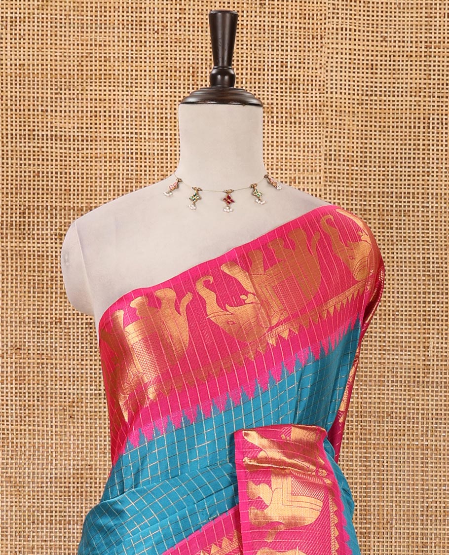 Blue checked semi-tafeta saree, contrast temple zari elephant motifs border, striped pallu & matching checked zari border blouse