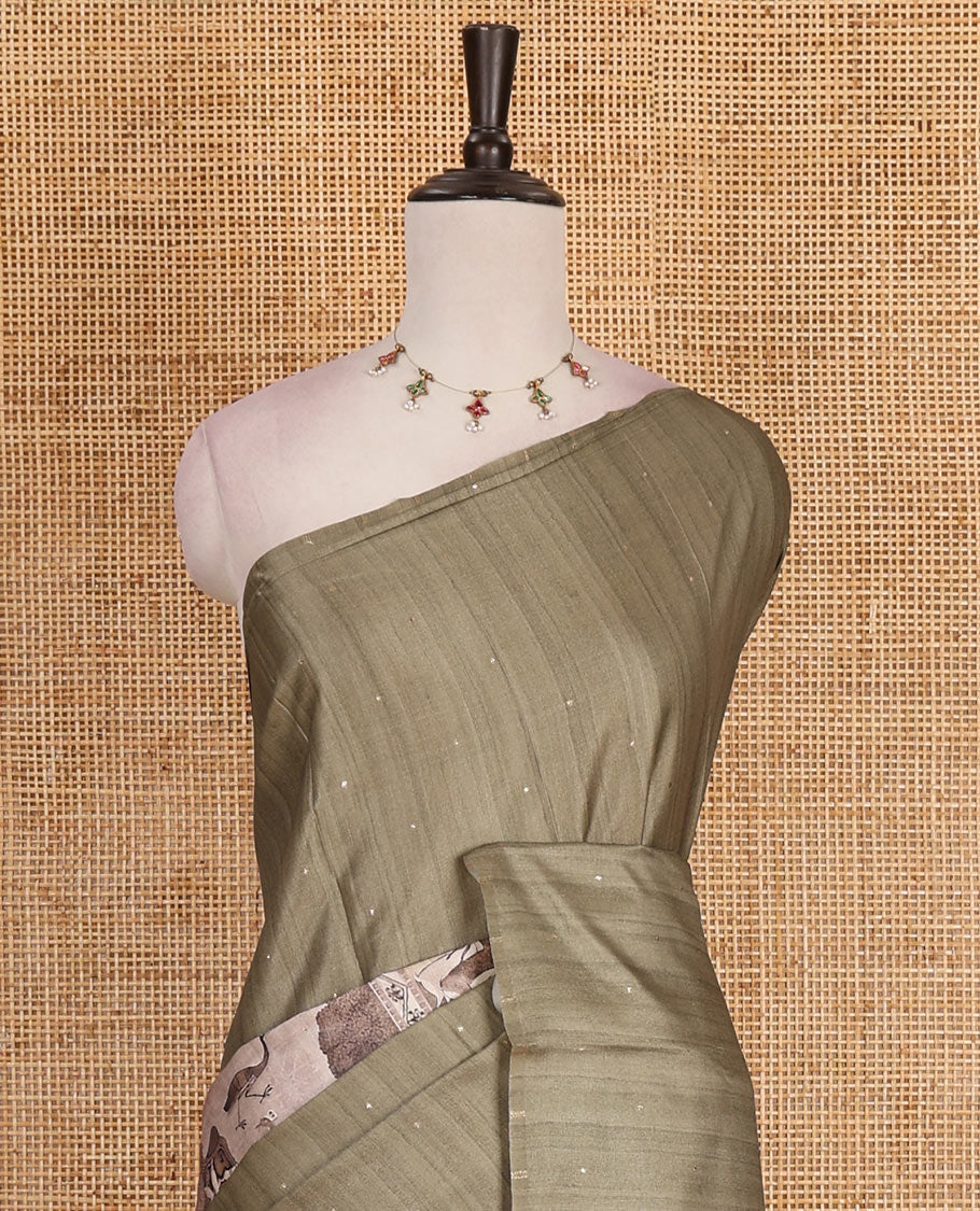 Borderless Green dobby style buttas and animal motifs printed semi tussar saree, contrast digital printed blouse