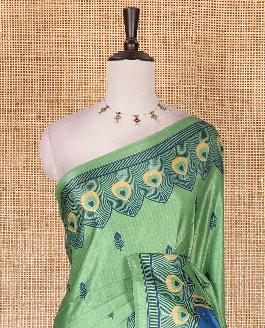 Parrot green peacock feathers motifs printed katan silk saree, peacock feathers printed border, contrast Radha Krishna stories printed pallu, and contrast printed blouse