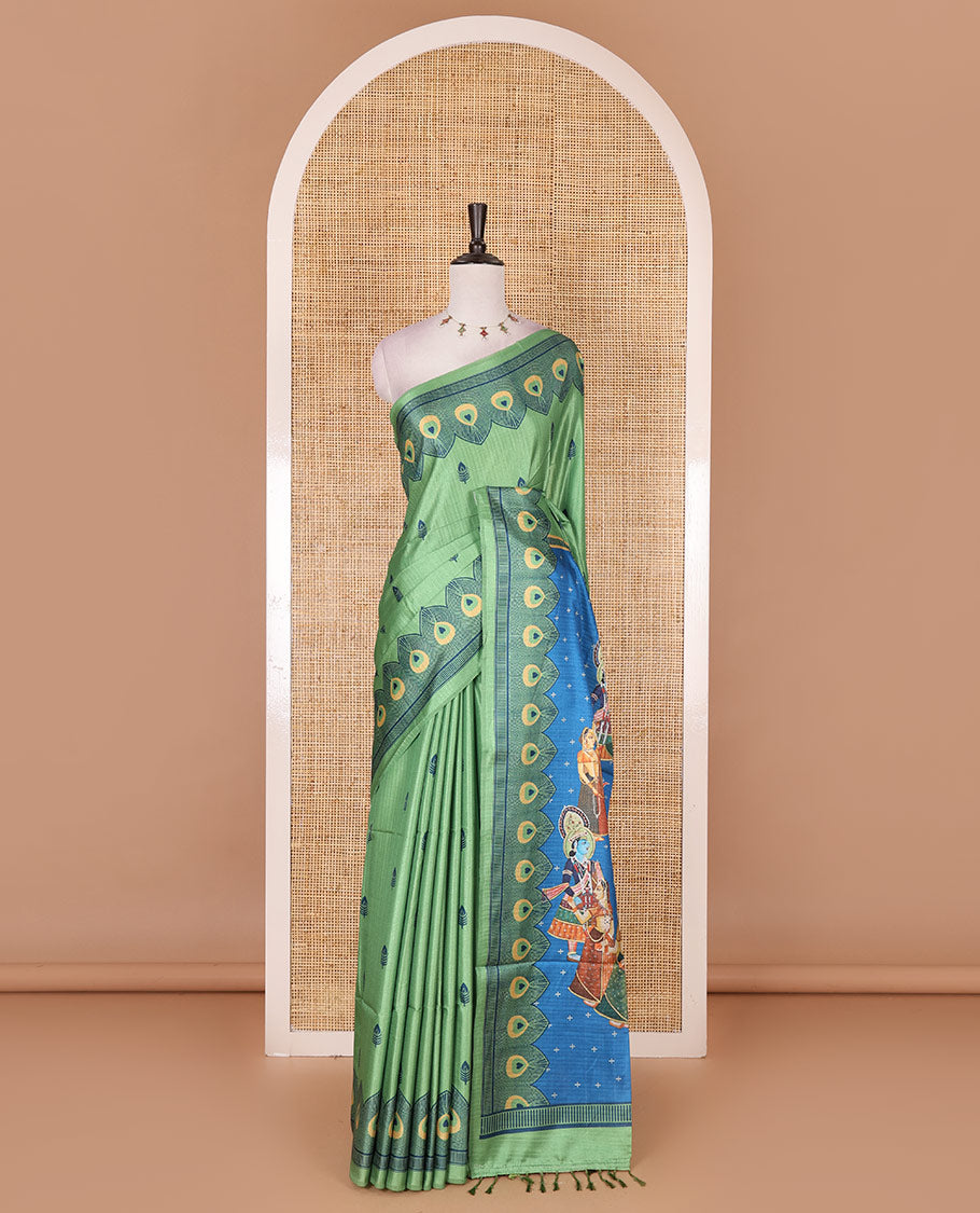 Parrot green peacock feathers motifs printed katan silk saree, peacock feathers printed border, contrast Radha Krishna stories printed pallu, and contrast printed blouse