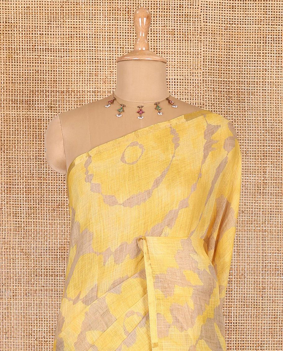 Borderless yellow batik printed linen cotton saree, hand brush painting style floral vine printed pallu, and contrast floral printed blouse