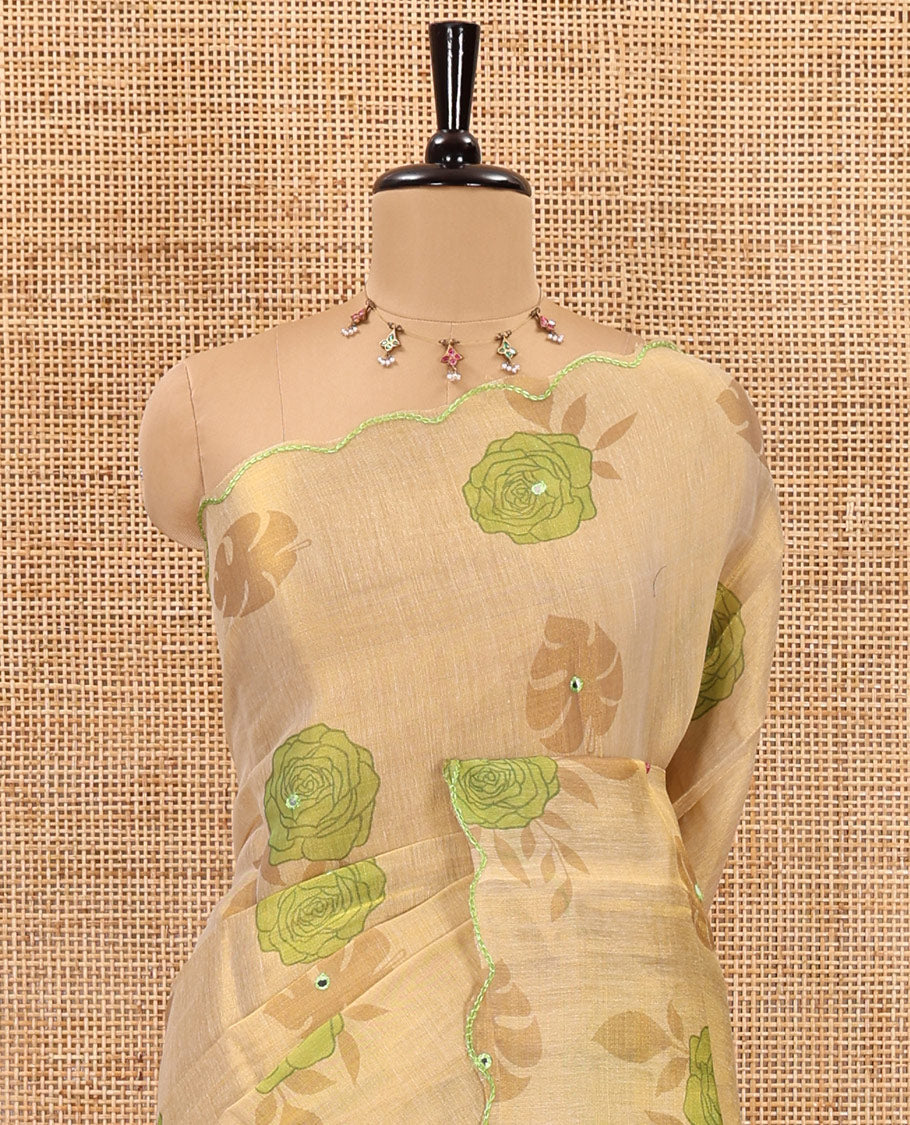 Gold and green rose motifs printed with mirror work tissue saree, scallop embroidered border, printed pallu, and a contrast blouse