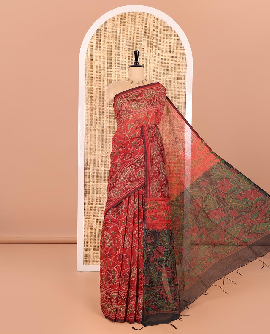 Red Khadi Cotton Saree Mesmerized with Kalamkari-Style Paisley-Floral Prints, Subtly Sparkled with Self-Border of Floral Creeper Designs, Complemented by Contrast Paisley-Floral Vine Pallu, and Paired with a Contrast Printed Blouse
