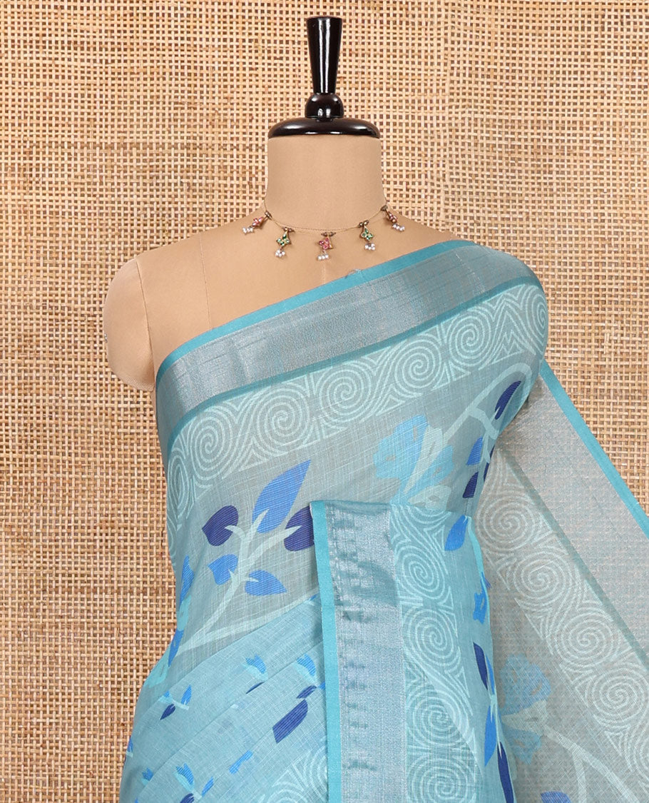 Blue Linen Cotton Saree, Prettified with Leaf Vine Printed on Its Body, Contrast Bavanji Border, Printed Pallu, and Paired with a Contrast Blouse