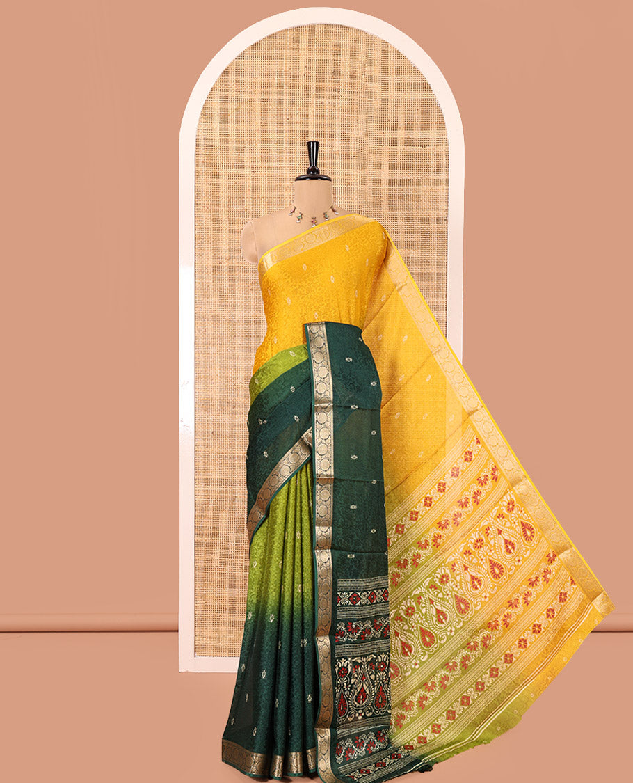 Yellow and Green Candy Chiffon Saree, Bedecked with Floral Vine Embossed, Buttas, and Ombre-Style Dyed on Its Body, Highlighted by Floral Creeper Zari Border, Intricately Designed Pallu, and Paired with a Contrast Blouse