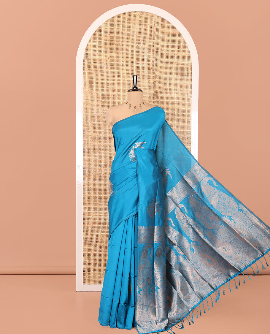 Borderless Peacock Blue Kanchi Silk Saree, Opulently Embellished with Zari Buttas, Intricate Pallu, and a Matching Blouse