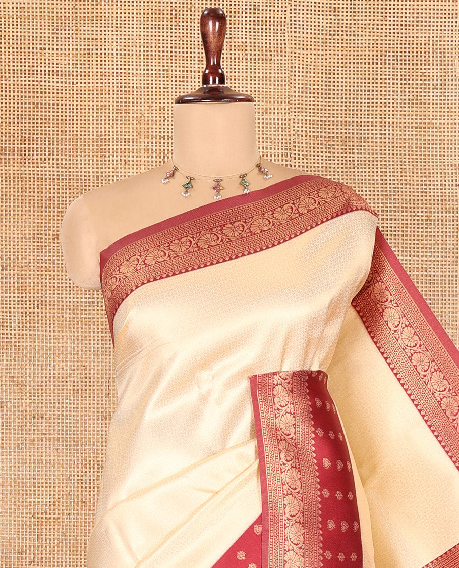 Cream-Maroon Embossed Art Kanchi Silk Saree, a Contrast Traditional Zari Border, Grand Jaal Pallu, and a Contrast Blouse