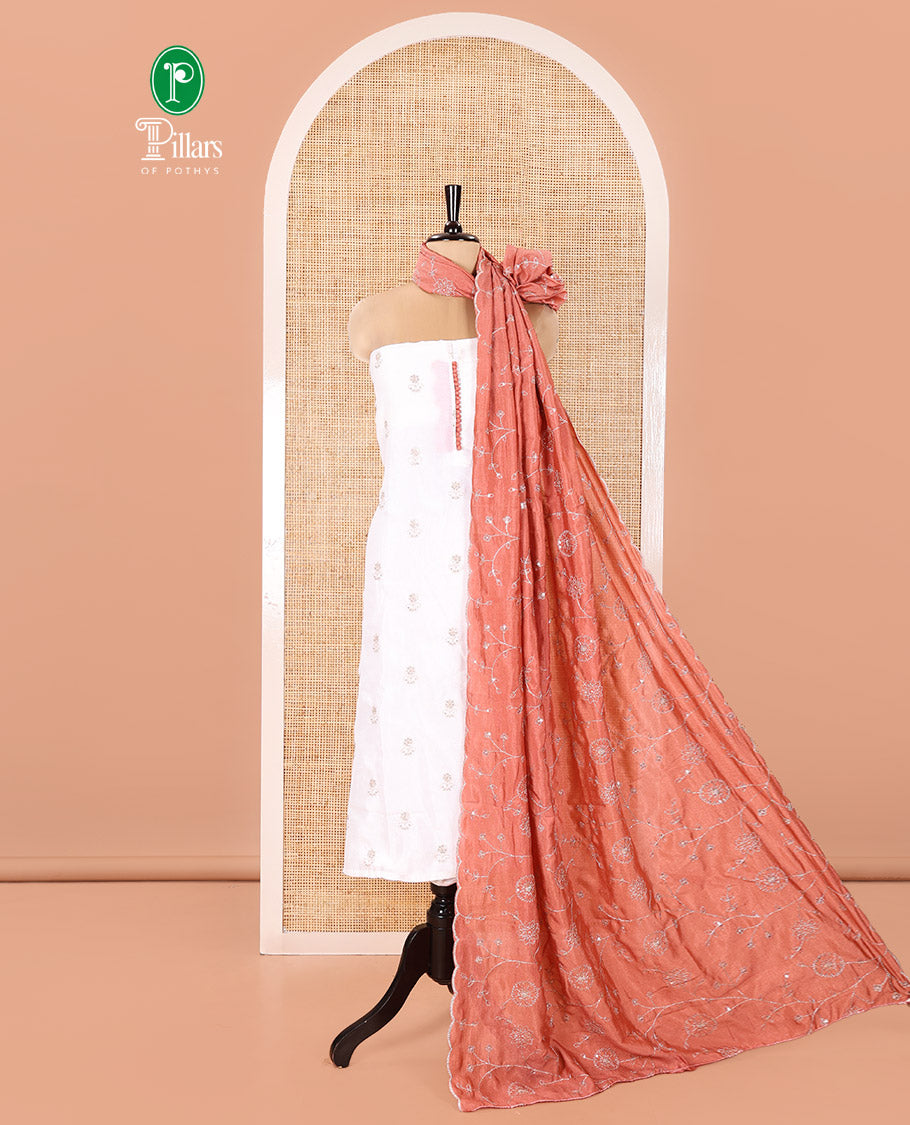 Cream with Dark Peach Vichitra Silk Material Chudidar Set, Elevated with Gold Zari Buttas On Its Top, a Plain Santoon Bottom, and Comes with a Floral Vine Sequins Embroidered Dupatta