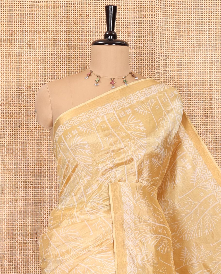 Gold tree motifs printed banana pith saree, zari piping border, floral printed pallu, and a matching printed blouse