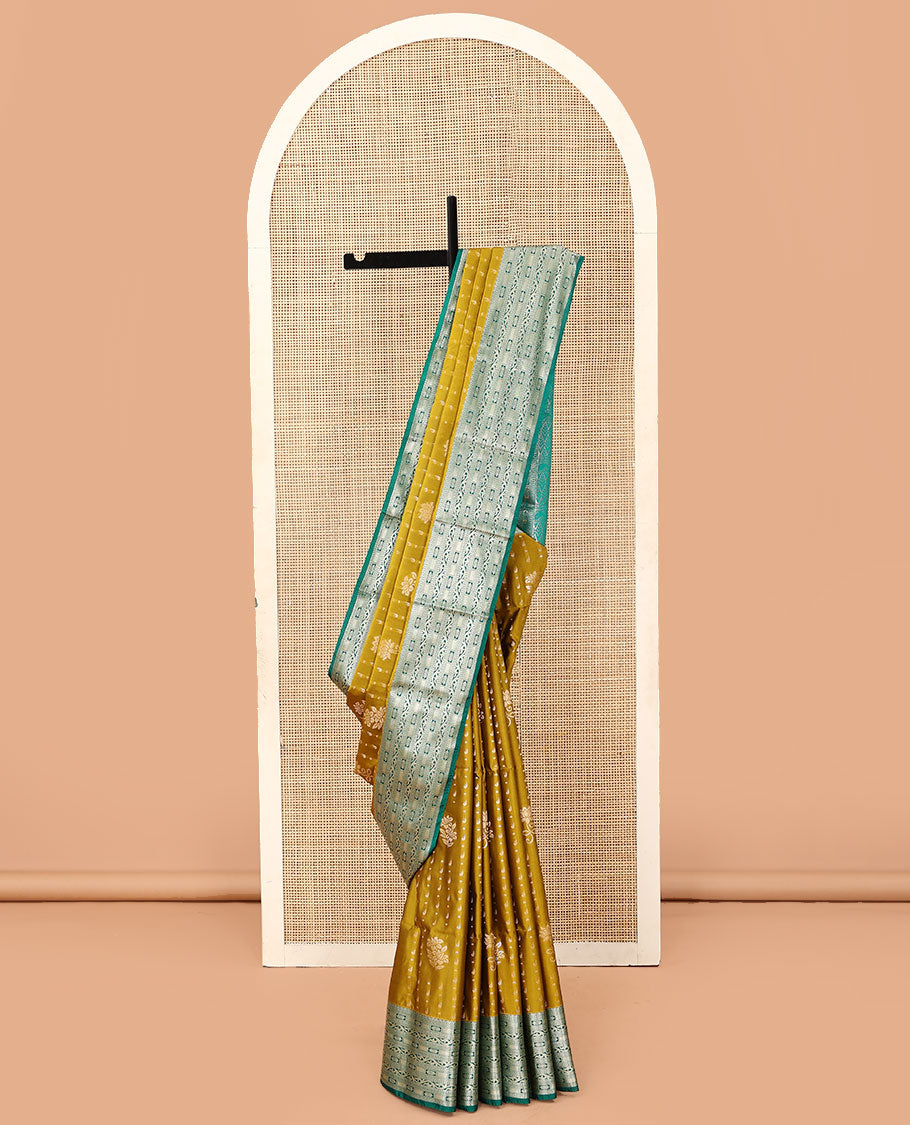 Green floral buttas soft silk saree, contrast traditional zari design border, and pallu of geometric patterns