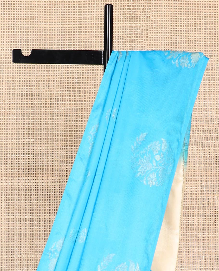 Light blue buttas soft silk saree with self flower design border & zari design pallu