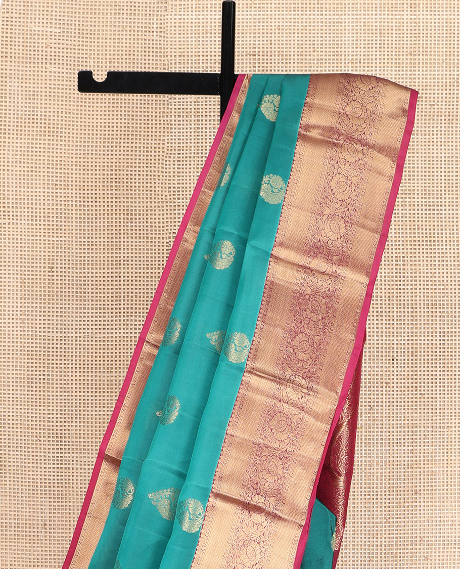 Teal Vasundhara Lite Silk Mix Saree, Elegantly Highlighted with Zari Buttas, Complemented by a Contrast Border of Kodi Visiry Designs, Opulently Embellished Pallu, and Paired with a Contrast Blouse