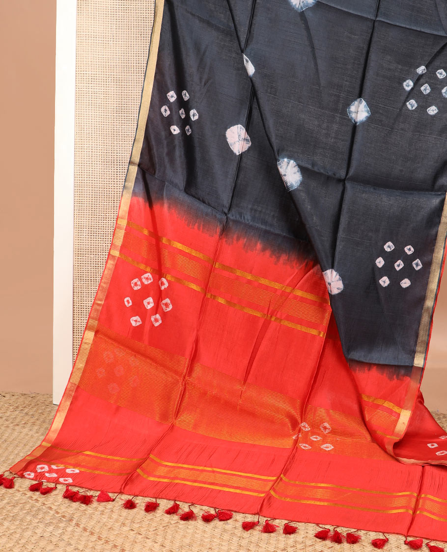 Black shibori printed banana pith saree, piping border, and contrast shibori print with zari stripes