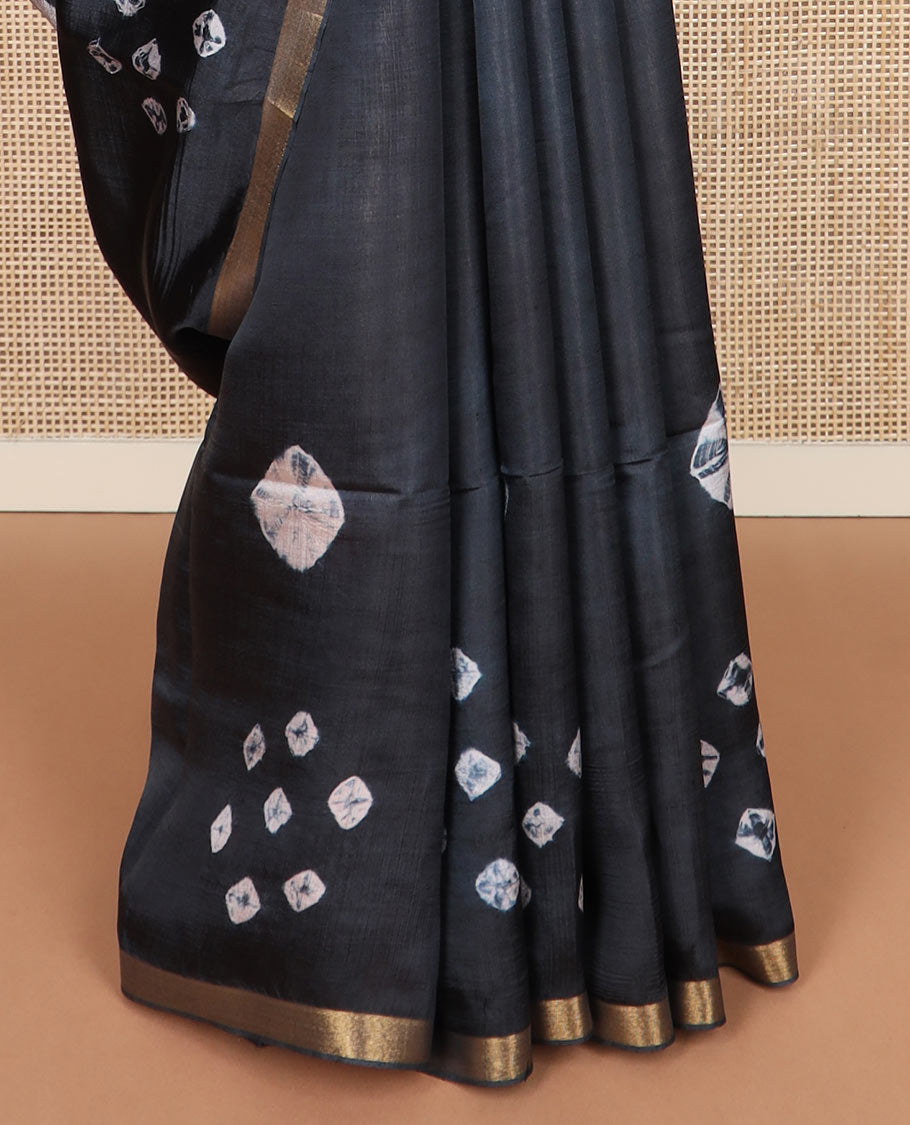 Black shibori printed banana pith saree, piping border, and contrast shibori print with zari stripes