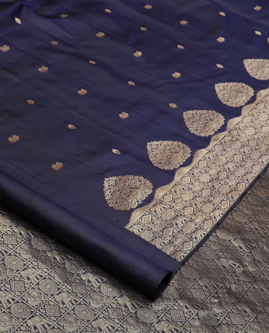 Navy blue zari buttas silk saree, zari border and pallu of zai yaanai, mayil, chakram, and diamond buttas enclosed checks