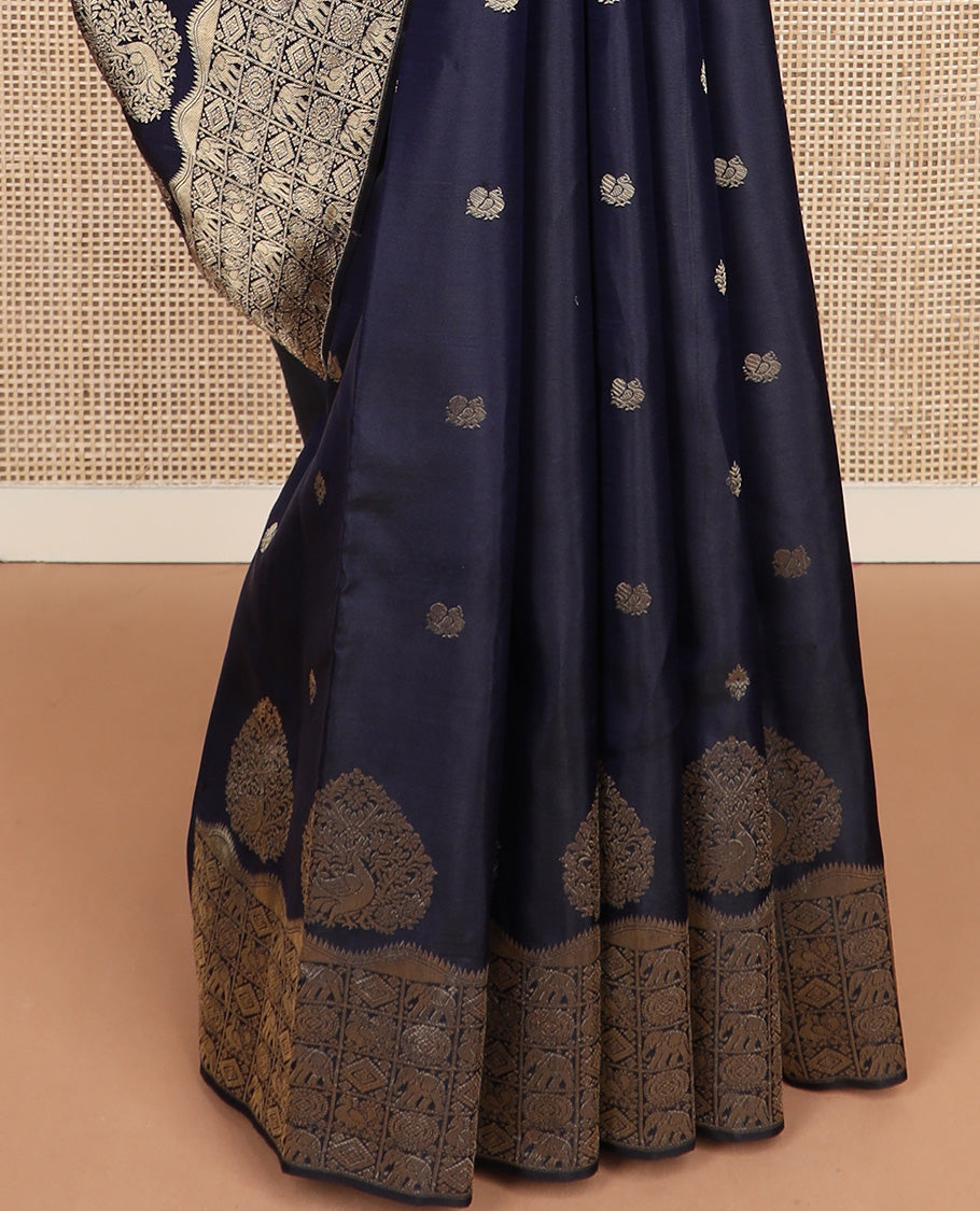 Navy blue zari buttas silk saree, zari border and pallu of zai yaanai, mayil, chakram, and diamond buttas enclosed checks