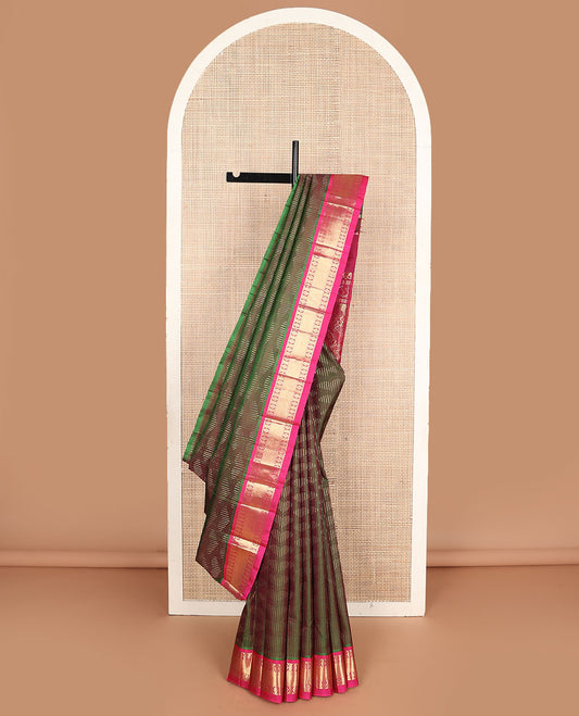 Green dual-tone zari buttas Kanchipuram silksaree, contrast one-sided border of kamalam & mayil kann design & intricate pallu