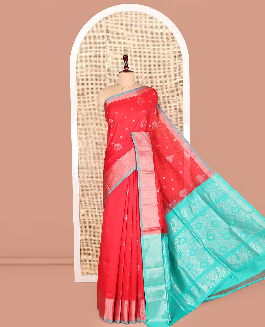 Red Kuppadam Cotton Saree, Gleamed Up with Zari Buttas All Over Its Body, Complemented by a Bavanji Border, Pallu of Intricate Designs, and Paired with a Contrast Blouse