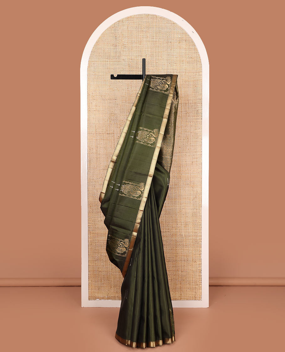 Green mayil buttas soft silk saree, zari piping border, and pallu of intricate designs