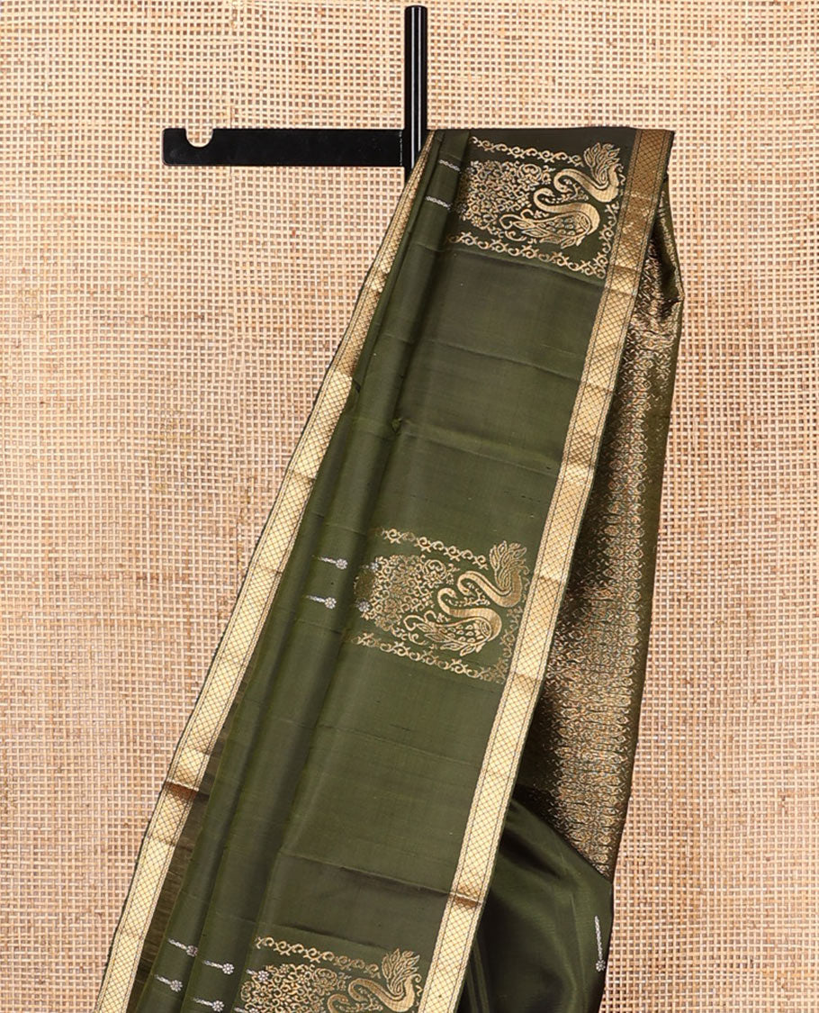 Green mayil buttas soft silk saree, zari piping border, and pallu of intricate designs