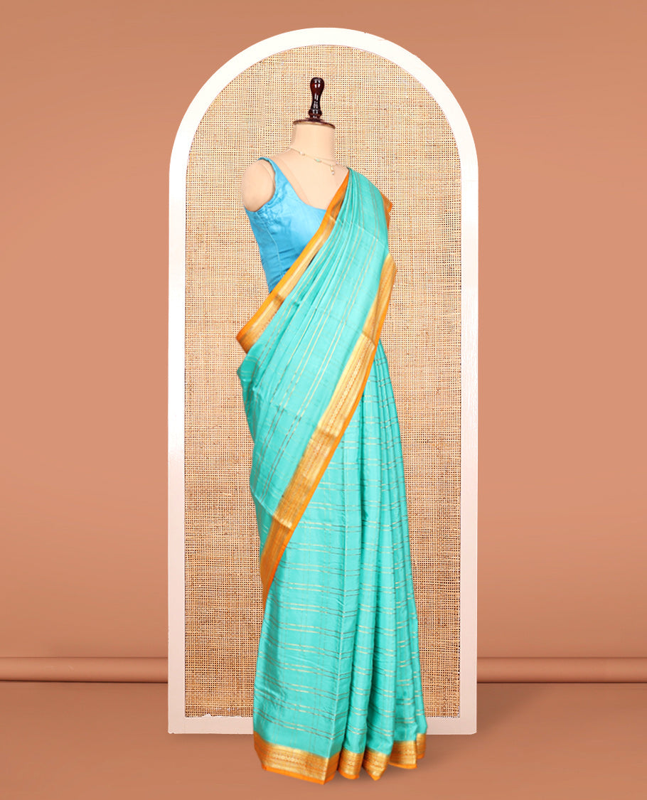 Blue Mysore Silk Saree, Gleamed up with Zari Checked Design on its Body, Complemented by Captivating Contrast Border of Traditional Zari Designs, Pallu of Tropical Flora and Flamingo Bird Designs, and Paired with a Contrast Blouse