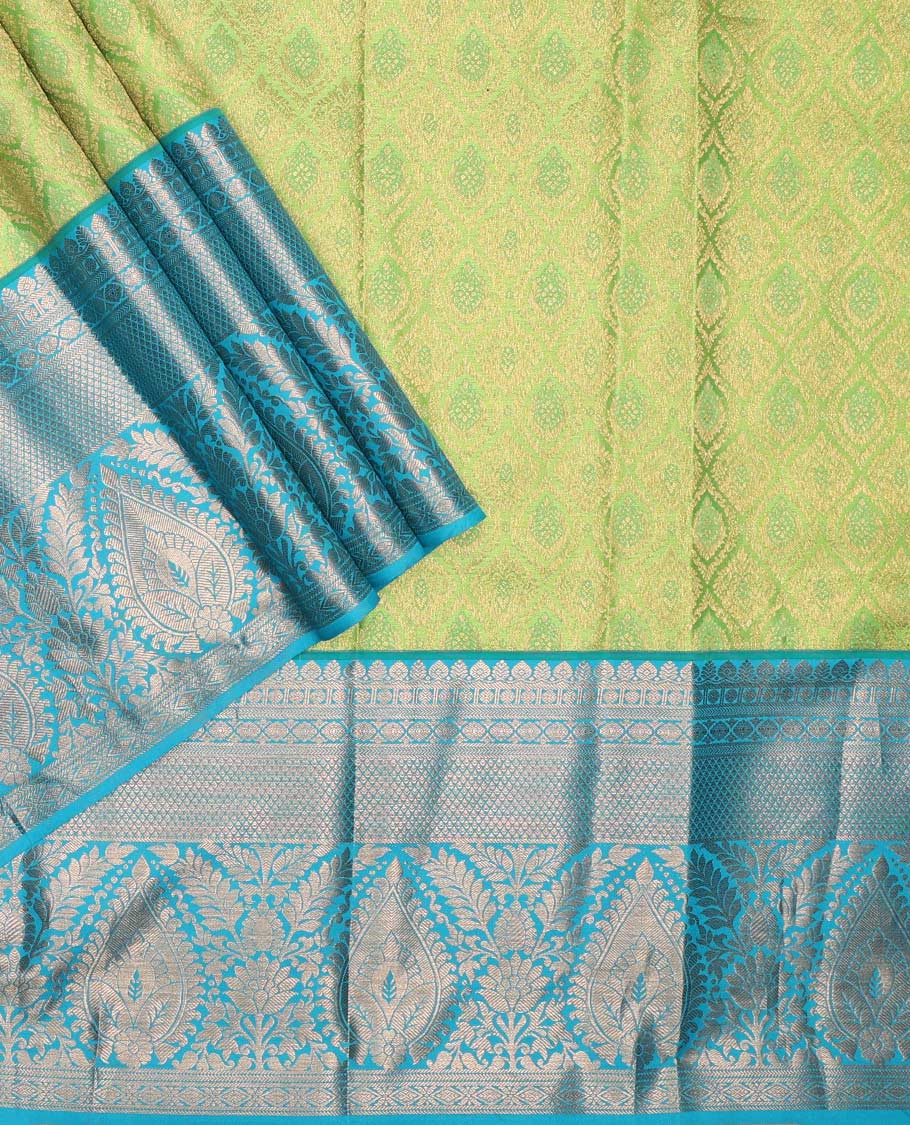 Green pure-silk half saree, jacquard with contrast traditional zari bordered skirt, blouse of thilakam mokku,poun, vanki, and thilakam designs , and zari design dhavani