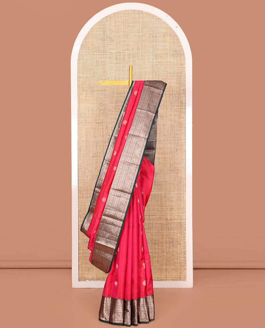 Red Vasundhara Silk Saree Accentuated with Zari Buttas All Over Its Body, Highlighted with a Contrast Border of Traditional Zari Designs, Pallu Delicately Woven with Jaal Designs, and Paired with a Contrast Blouse