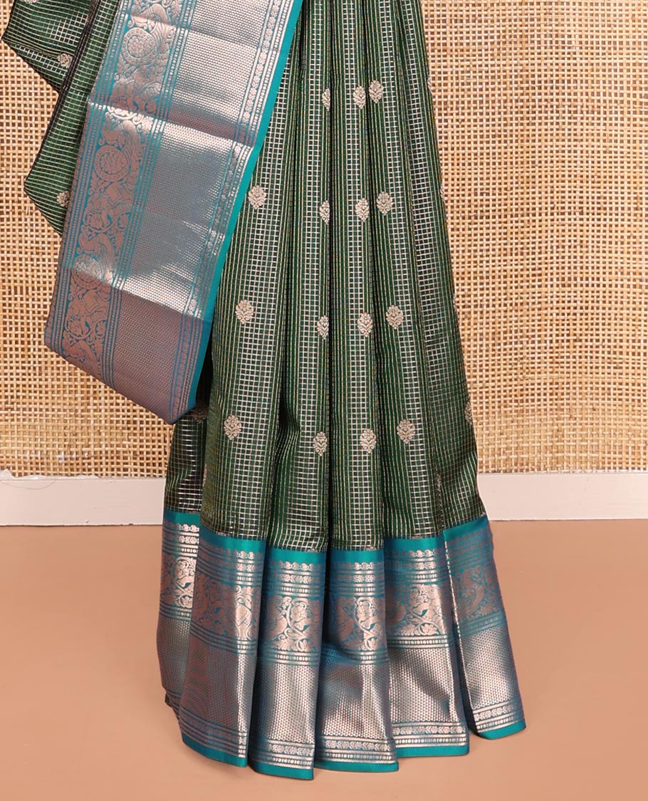 Green Vasundhara Silk Saree, Steeped in Richness of Zari Buttas and Checked Design on Its Body, Complemented by a Contrast Border of Manga, Floral, Mayil, Yaanai, and Ara Maadam Designs, Opulently Embellished Jaal Pallu, and Paired with a Contrast Blouse