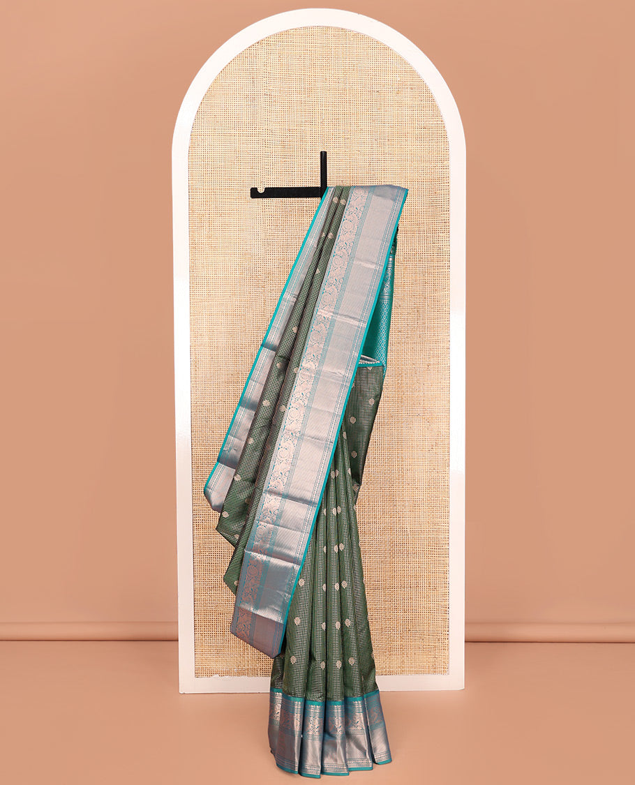 Green Vasundhara Silk Saree, Steeped in Richness of Zari Buttas and Checked Design on Its Body, Complemented by a Contrast Border of Manga, Floral, Mayil, Yaanai, and Ara Maadam Designs, Opulently Embellished Jaal Pallu, and Paired with a Contrast Blouse