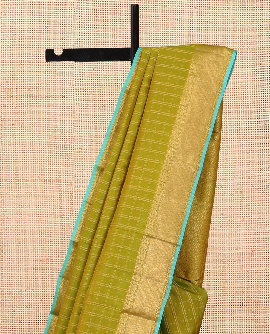 Green Vasundhara Silk Saree, Woven with Zari Checks, a Zari Border of Mayil, Kuthirai, Muthu, Mayil Kann and Rudraksham Designs, Grand Pallu, and a Contrast Blouse