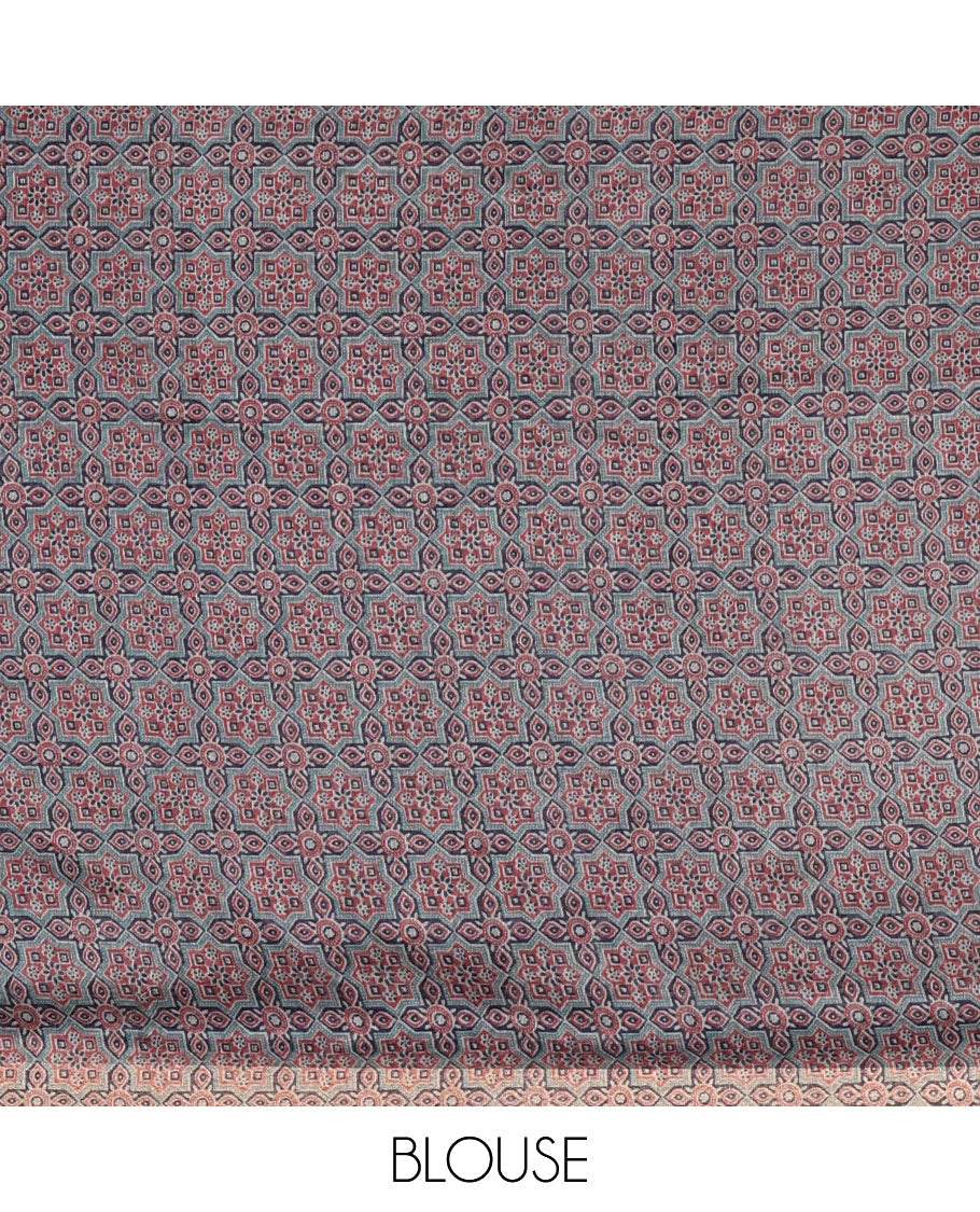 Navy blue bandhani-style floral and chakra printed saree, zari piping border, contrast ajrakh printed pallu, and contrast ajrakh printed blouse