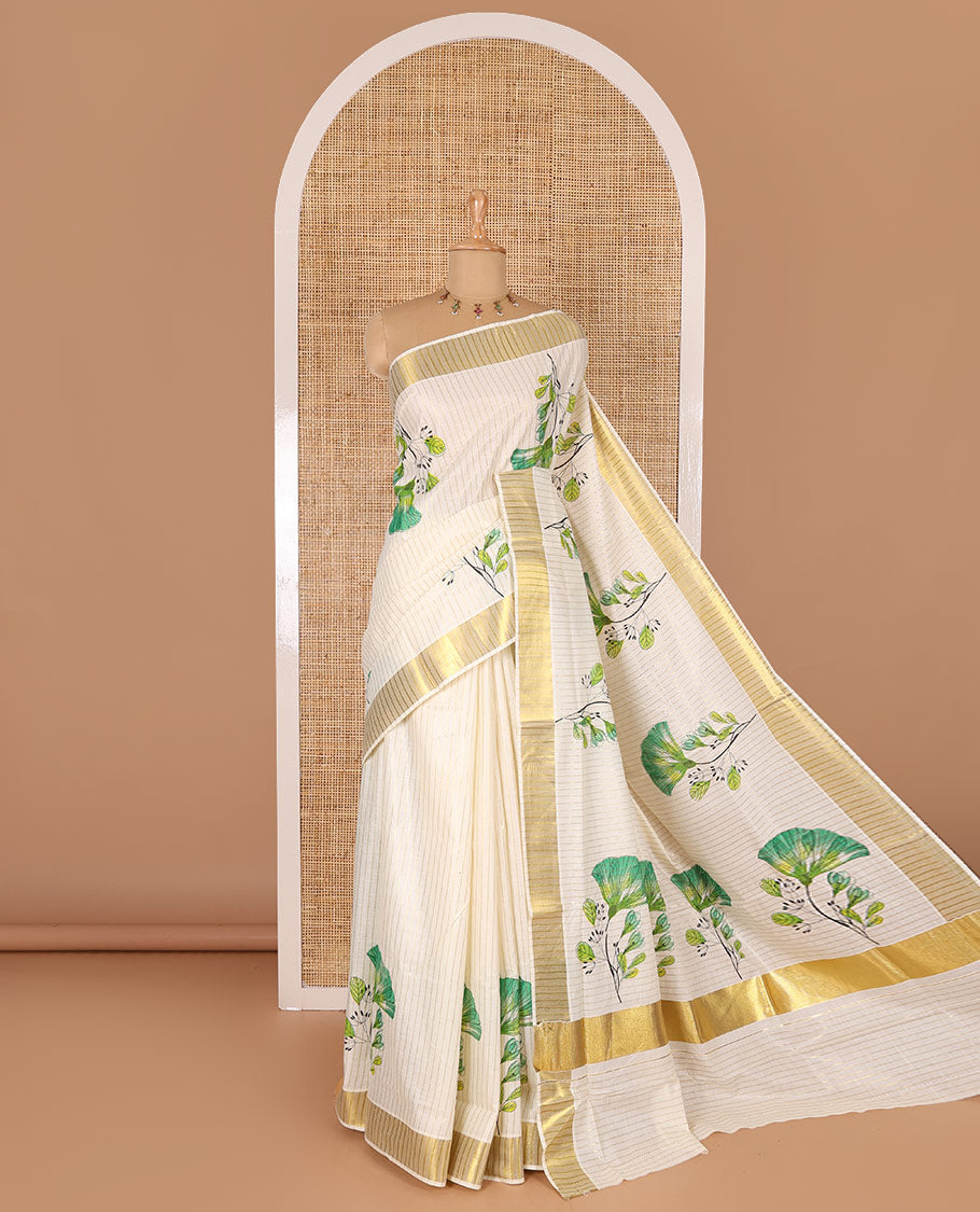 Cream and green vertically striped with handblock floral motifs printed Kerala cotton saree, zari striped border, handblock floral printed pallu, and a matching blouse