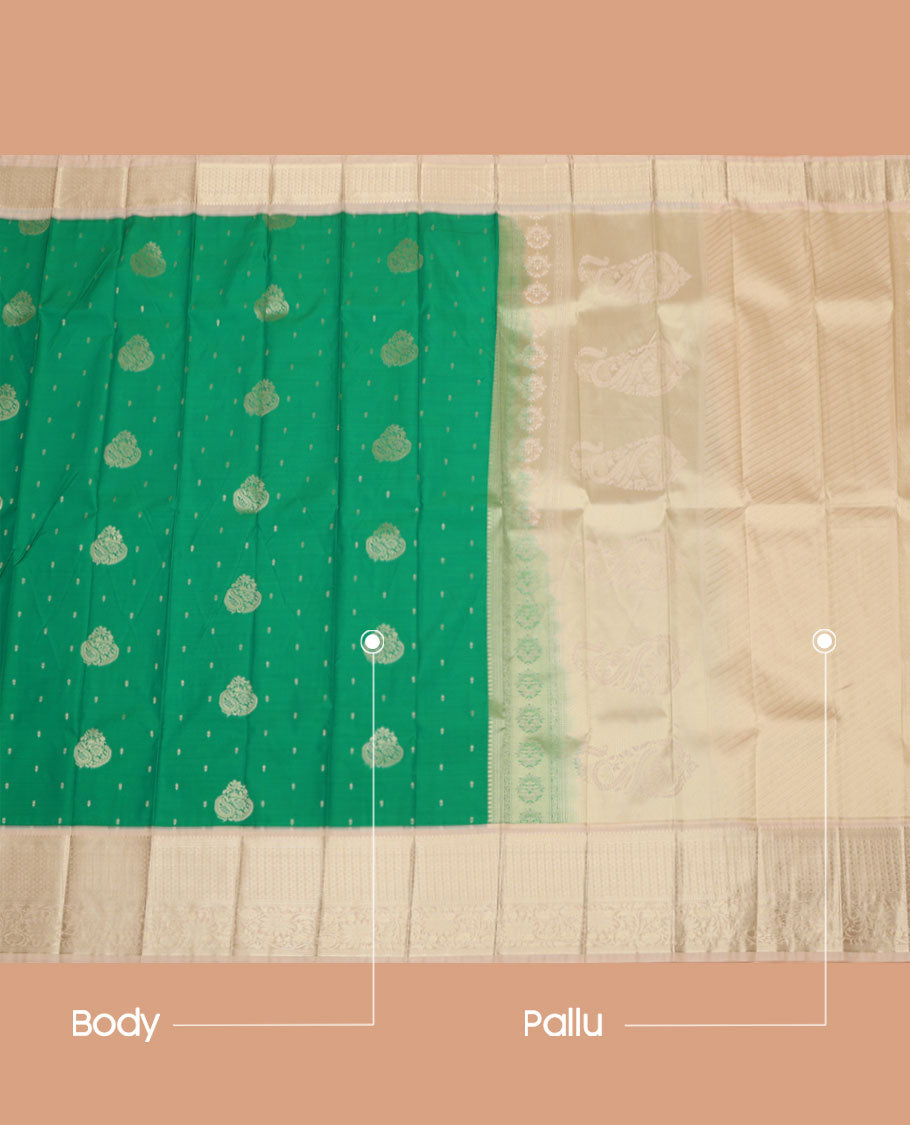Green Budget Silk Saree, Styled with Zari Buttas on Its Body, Complemented by a Contrast Traditional Zari Design Border, Pallu of Paisley and Strip Designs, and Paired with a Contrast Blouse