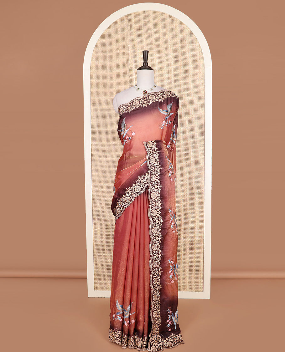 Orange crane and floral motifs thread embroidered designer saree, scallop floral thread embroidered border, and embroidered pallu