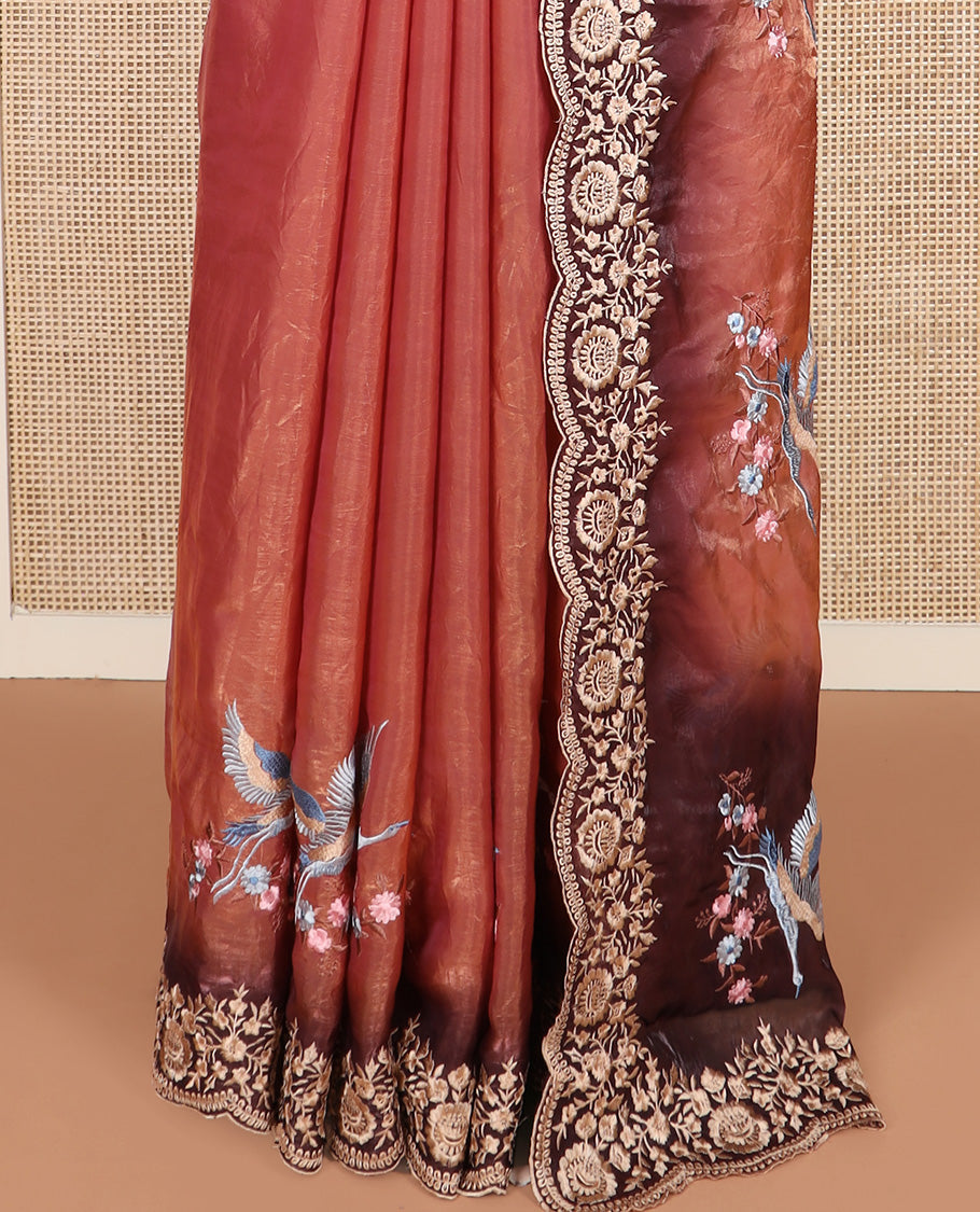 Orange crane and floral motifs thread embroidered designer saree, scallop floral thread embroidered border, and embroidered pallu