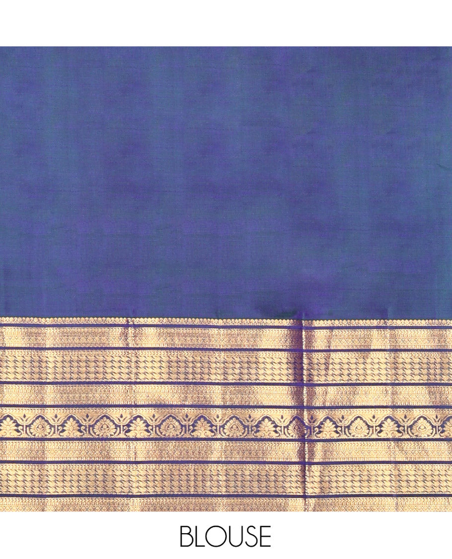 Blue Kanchipuram Silk Saree, Embellished with Mayil and Chakram Buttas All Over Its Body, Highlighted by a Zari Border of Traditional Designs, Pallu Steeped with Traditional Designs, and Paried with a Matching Blouse