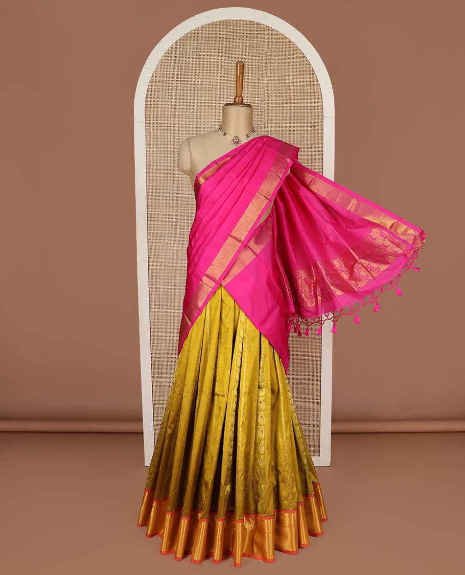 Green puresilk halfsaree, zari design skirt, contrast blouse, and border features rekku, diamond, arumbu manga, jaal design, and floral design dhavani