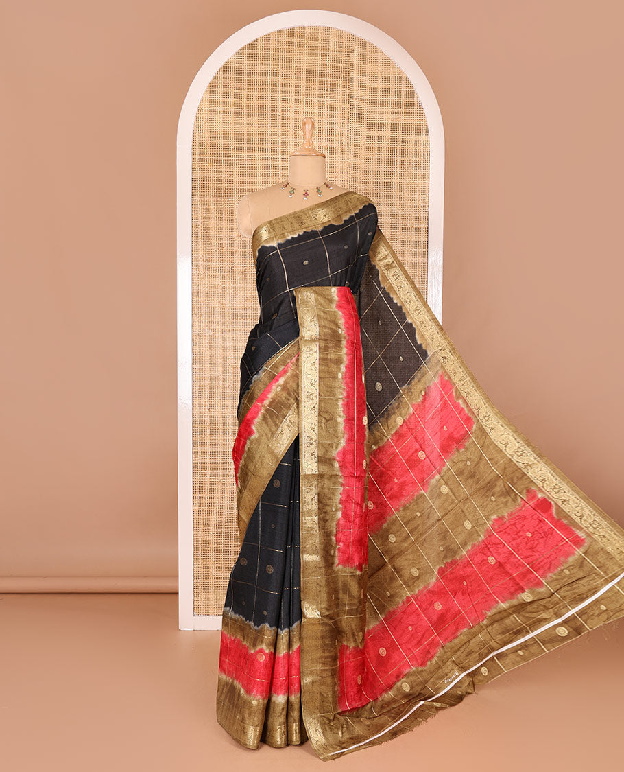 Black buttas enclosed checked dola silk saree, contrast shibori print with traditional zari border, buttas enclosed checked pallu, and a contrast buttas enclosed checked blouse