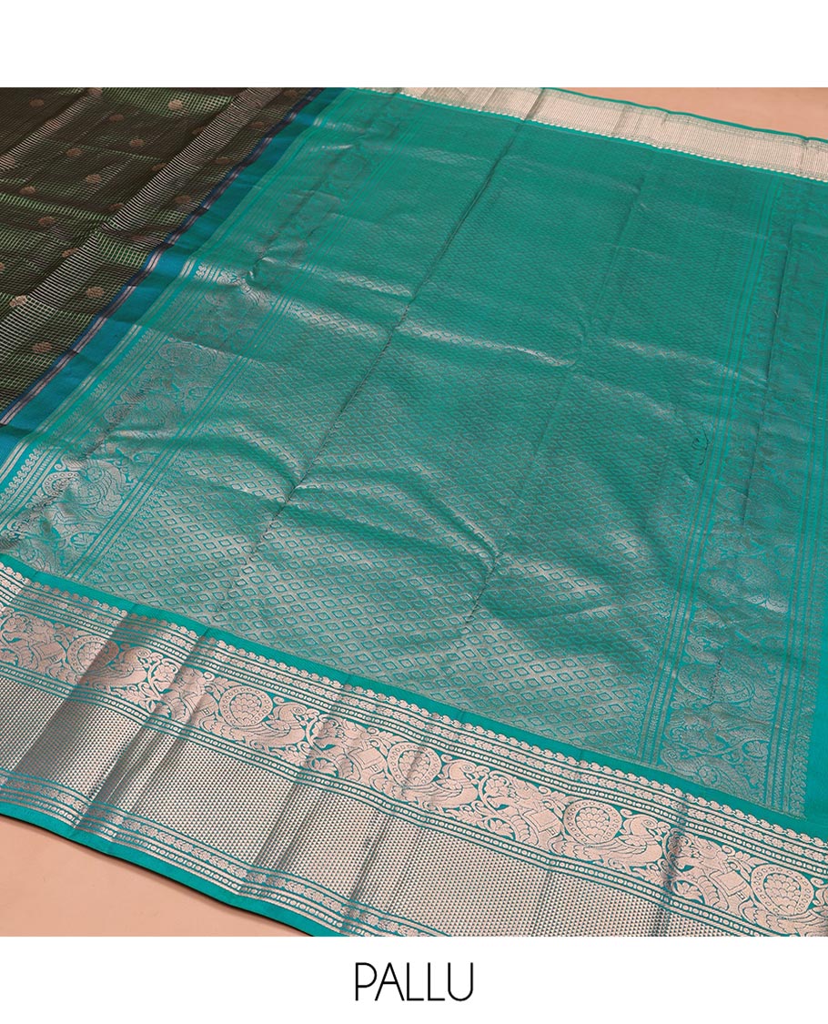 Green Vasundhara Silk Saree, Steeped in Richness of Zari Buttas and Checked Design on Its Body, Complemented by a Contrast Border of Manga, Floral, Mayil, Yaanai, and Ara Maadam Designs, Opulently Embellished Jaal Pallu, and Paired with a Contrast Blouse