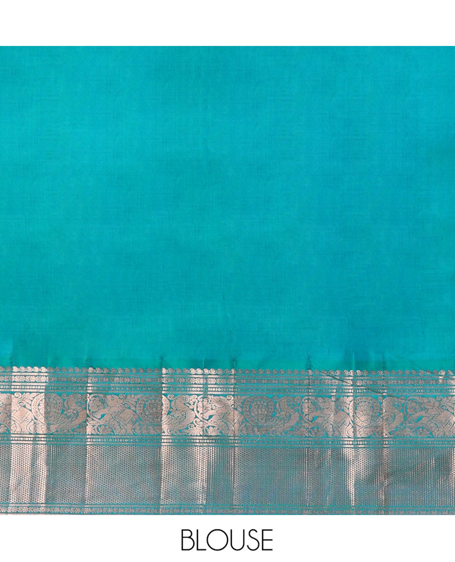 Green Vasundhara Silk Saree, Steeped in Richness of Zari Buttas and Checked Design on Its Body, Complemented by a Contrast Border of Manga, Floral, Mayil, Yaanai, and Ara Maadam Designs, Opulently Embellished Jaal Pallu, and Paired with a Contrast Blouse